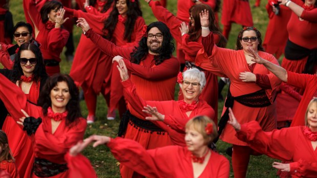 Beards among the flashmob. Men and women unite to swoop and sway to Kate Bush's <i>Wuthering Heights</I>.