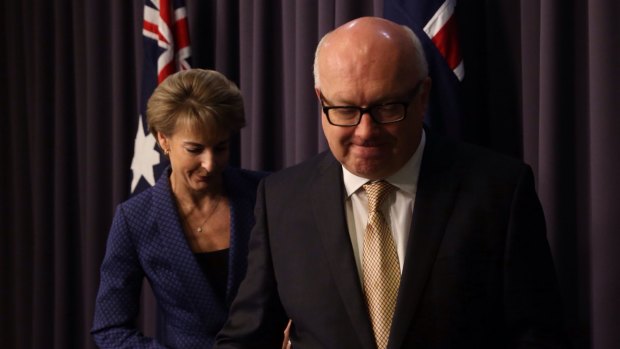 George Brandis and Michaelia Cash announce the cuts reversal on Thursday.
