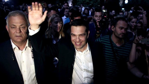 Greek Prime Minister Alexis Tsipras waves as he arrives at the Greek state broadcaster ERT in Athens on Thursday. 