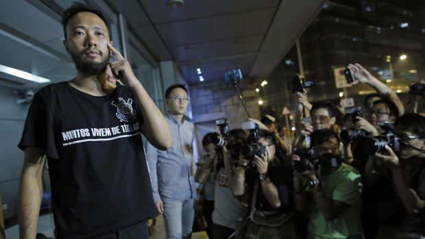 Pro-democracy activist Ken Tsang leaves a police station after being granted bail. 
