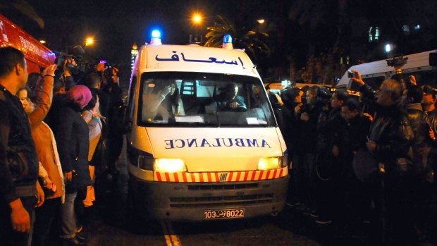An ambulance rushes to the scene of a bus explosion in the centre of the Tunisian capital.