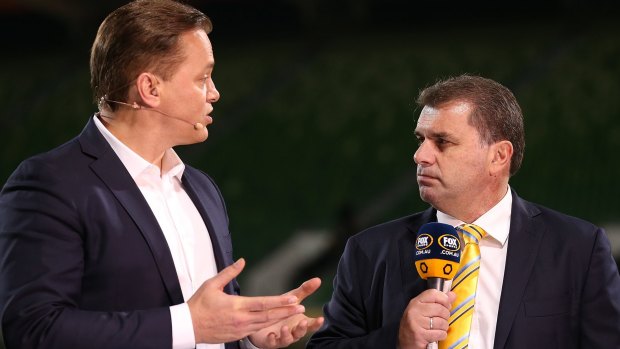 Taking it as it comes: Soccaroos coach Ange Postecoglou talks to Mark Bosnich after the game against Bangladesh.