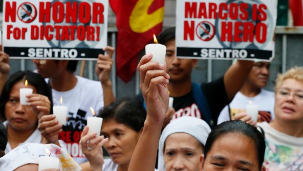 Protesters outside the Philippine Supreme Court in Manila oppose the burial of the late Philippine dictator Ferdinand Marcos at the Heroes' Cemetery.
