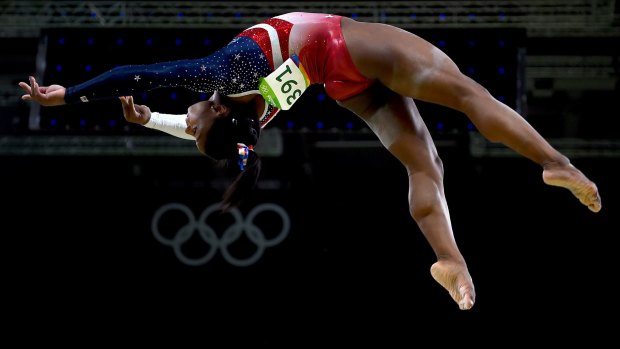 Simone Biles of the United States competes on the balance beam during the Artistic Gymnastics Women's Team Final. 