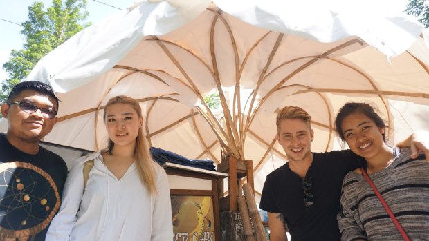Architecture students Fauzan Alfi A, Stephanie Cheung, Laras Winarso and Matthew Hunter with a prototype of their street vendor shelter to be used in Indonesian cities.