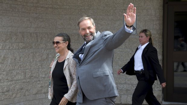 New Democratic Party leader Thomas Mulcair waves in Gatineau, Quebec on Sunday.
