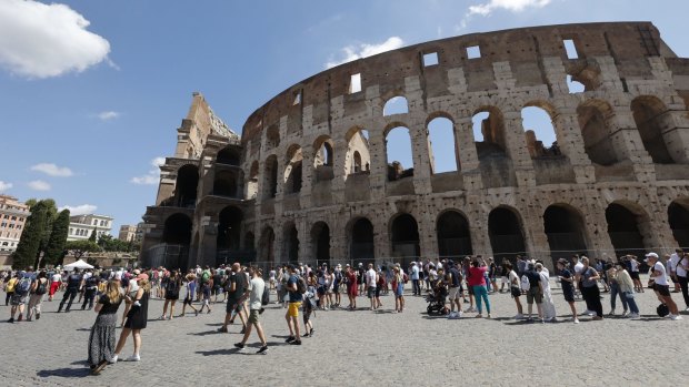Tourists queue to enter the Colosseum in Rome last week. They need to provide proof of vaccination or a negative test from the previous 48 hours to enter.
