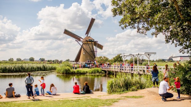 The old windmills in Kinderdijk village – a famous landmark in Netherlands.