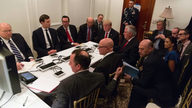 President Donald Trump receives a briefing on the Syria military strike from his National Security team at Mar-a-Lago after the strike.