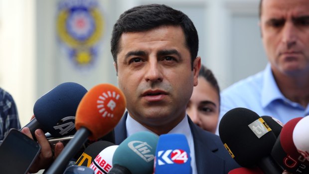 Pro-Kurdish Peoples Democracy Party leader Selahattin Demirtas speaks to the media about Turkey's air strikes against Kurdish rebel bases in Iraq on Monday.