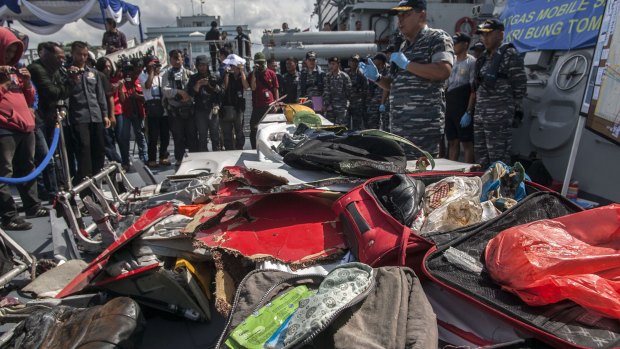 Indonesian Navy displaying recovered suitcases from the AirAsia flight QZ8501.