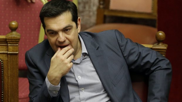Greek Prime Minister Alexis Tsipras reacts during a parliament meeting in Athens, on Saturday.