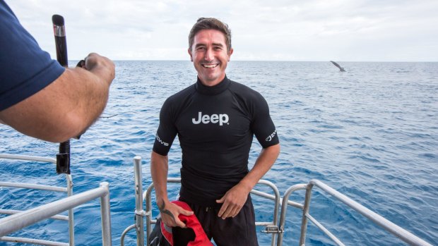Harry Kewell prepares to swim with whales off the Queensland coast.