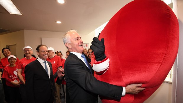 Malcolm Turnbull gets up close to National Heart Foundation mascot Have a Heart at Sydney's St Vincent's Hospital.