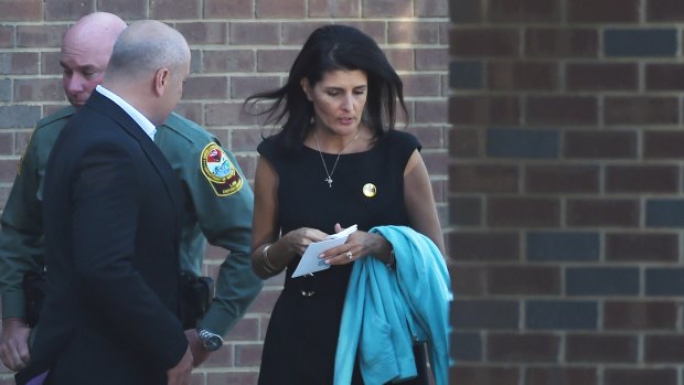 South Carolina Governor Nikki Haley, right, leaves the superhero-themed funeral service for Jacob Hall, who was killed in a school shooting in October.