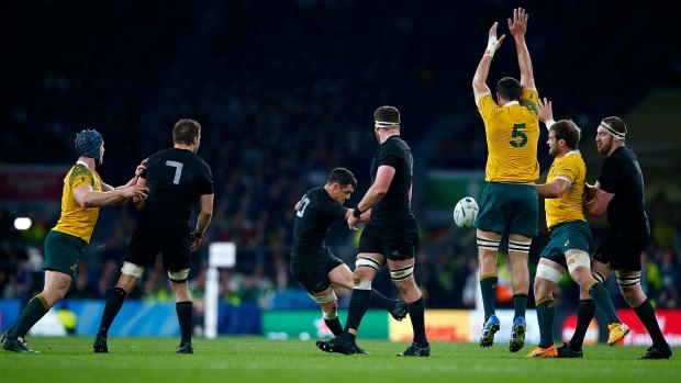 Crucial: Dan Carter lands his drop goal.