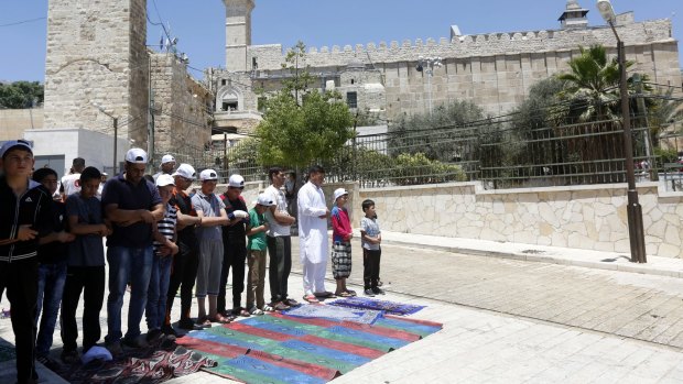 Palestinians attend Friday prayers at the Ibrahimi Mosque during the holy month of Ramadan. 
