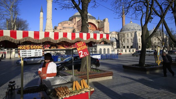 Bad for tourism: A vendor waits for customers at the near-empty plaza in front of the Byzantine-era Hagia Sophia, in the historic Sultanahmet district of Istanbul, following the explosion.