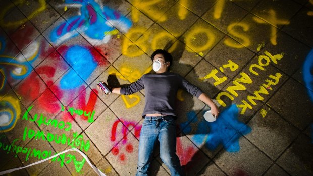 Dozens of ANU students seized an opportunity to spray paint messages on the university's Union Court before being closed off for demolition.