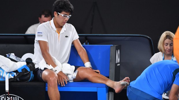 Chung receives treatment on his foot.