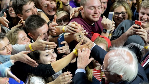 Democratic presidential candidate Bernie Sanders shakes hands with supporters after speaking at Temple University, Philadelphia, on Wednesday.