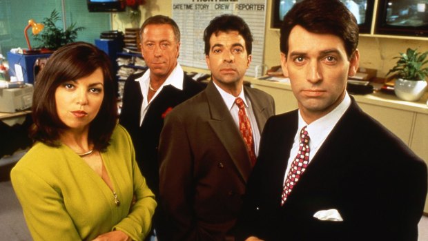Rob Sitch, right, as Mike Moore on <i>Frontline</i>, with co-stars Jane Kennedy, Steve Bisley and Tiriel Mora.