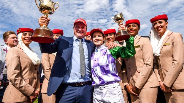 Winners are grinners: Darren Weir and Michelle Payne celebrate their Melbourne Cup win in 2015. 