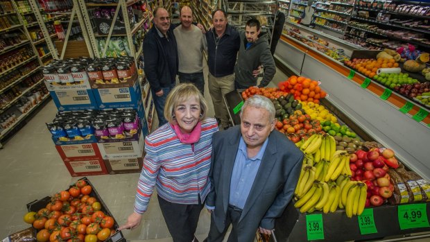 Olympia and Chris  Maleganeas with four of their five sons (l-r) John, Michael, Steven and Con (Christopher was absent) at the Red Hill supermarket the family ran for 51 years.