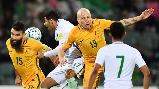 Aaron Mooy and Mile Jedinak in the midst of the action. 