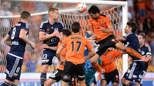 Heading home: Brisbane's Thomas Broich scores the goal that sent defending champions Melbourne Victory tumbling out of the finals race.