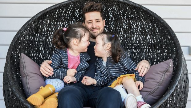 Starting young: Peter Davis is part of a Pretty Foundation campaign to use positive words to help girls with their body image. With his twin girls Madeline and Charlotte.