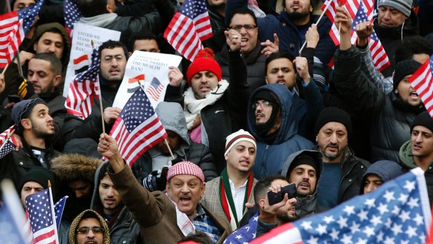 Muslims and Yemenis gather with their supporters on the steps of Brooklyn's Borough Hall during a protest against President Donald Trump's temporary travel ban.