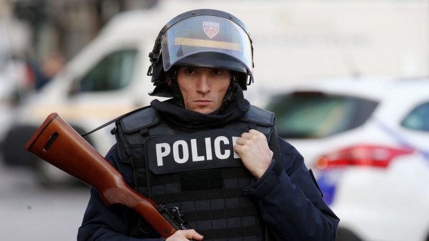 Military and police conduct an operation in Saint-Denis on Wednesday.