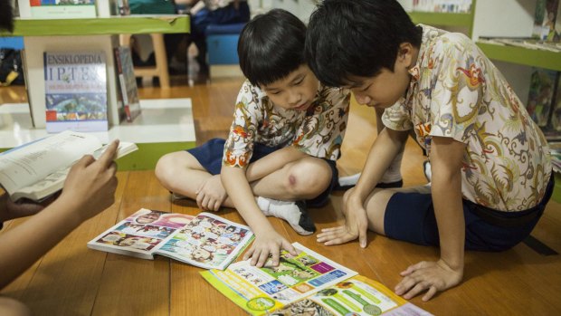 Two students of Kalam Kudus Primary school in Yogyakarta, Indonesia. The school is one of about 20 in the city that are trying out Australian teaching methods to make school more fun and improve outcomes.