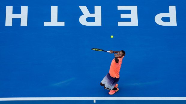 Kyrgios serves to Adam Pavlasek of the Czech Republic in Perth on Tuesday.