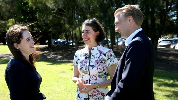 Premier Gladys Berejiklian (centre) congratulates North Shore and Manly candidates Felicity Wilson and James Griffin following Saturday's by-elections.