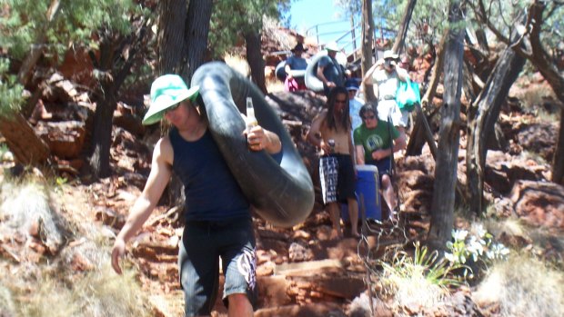 Matt Naysmith and mates carrying eskies and inner tubes on the way to the rockpool where he jumped and broke his neck. 