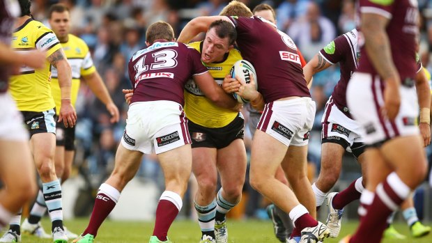 SYDNEY, AUSTRALIA - SEPTEMBER 06:  Paul Gallen of the Sharks is tackled during the round 26 NRL match between the Cronulla Sharks and the Manly Sea Eagles at Remondis Stadium on September 6, 2015 in Sydney, Australia.  (Photo by Matt King/Getty Images)