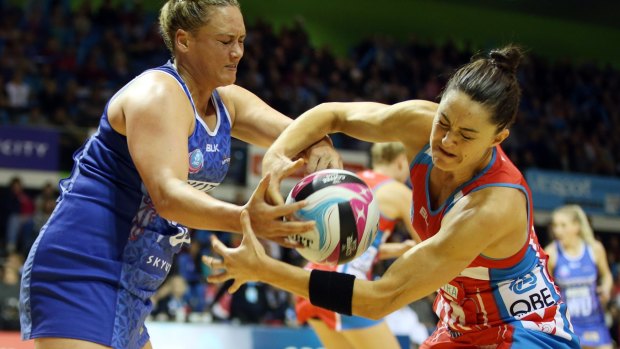 Tussle: The Mystics' Cathrine Tuivaiti and Sharni Layton of the Swifts fight for the ball.