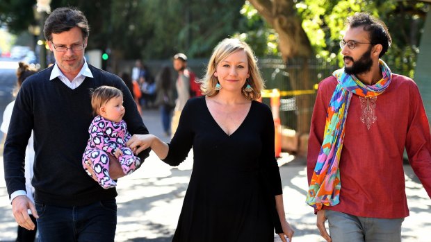 Cr Jonathan Sri accompanies Larissa Waters, her partner Jeremy Gates and daughter Alia Joy, to announce her resignation as a Greens senator.