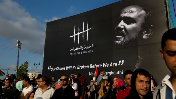 Protesters gather under a banner of jailed Palestinian leader Marwan Barghouti in the West Bank city of Ramallah earlier this month.
