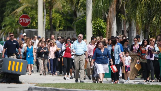 People evacuated due to a bomb threat return to the David Posnack Jewish Community Centre in Davie, Florida, in February.