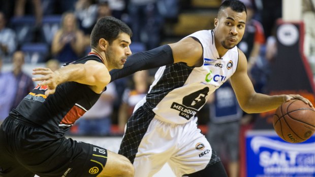 Standout performer: Melbourne United's Stephen Holt dribbles past the defence of Illawarra's Kevin Lisch on Thursday night.