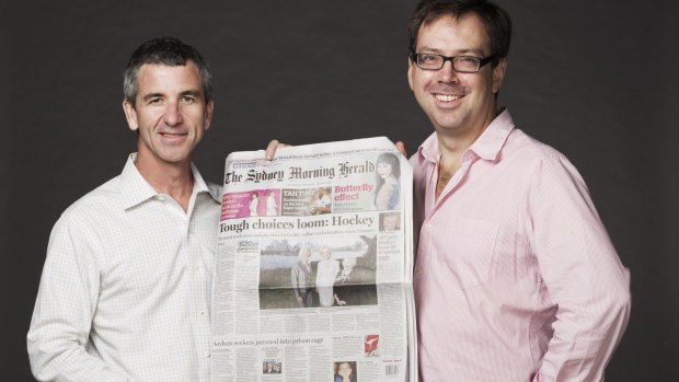 Editors Darren Goodsir and Michael Evans holding a copy of the last-ever broadsheet-sized <i>Sydney Morning Herald</i>.