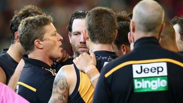 Damien Hardwick talks to his players during a break in the game.