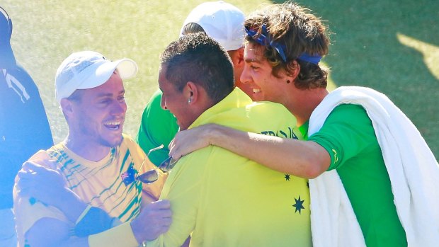 Leader: Lleyton Hewitt celebrates with his Davis Cup teammates Nick Kyrgios and Thanasi Kokkinakis.