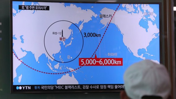 A TV news report on the range of North Korea's missiles at the Seoul Train Station in South Korea.