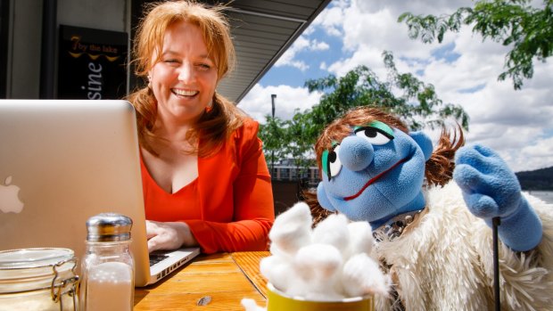 Caroline Simmone O'Brien enjoys some cafe time with Lady Puppet. 