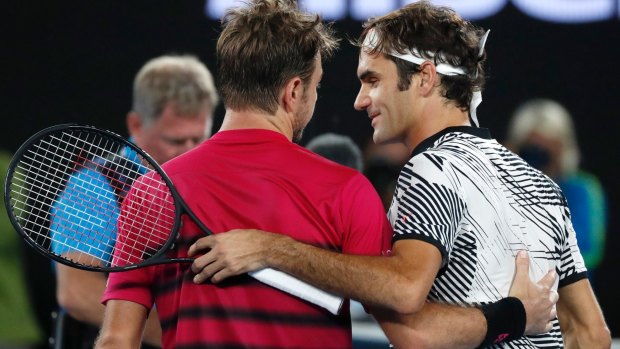 Federer is congratulated by Wawrinka.