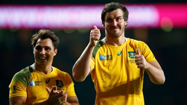 Delighted duo: Kane Douglas (right) and Nick Phipps celebrate after the 2015 Rugby World Cup Pool A match between Australia and Wales at Twickenham Stadium.